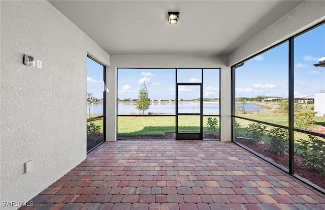 16740 Rolling Rock Blvd, Alva, FL 33920 - unfurnished sunroom with a textured wall and a water view