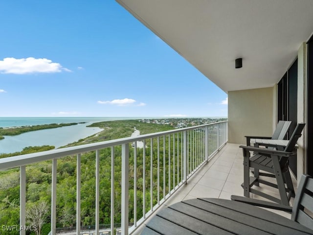 balcony featuring a water view