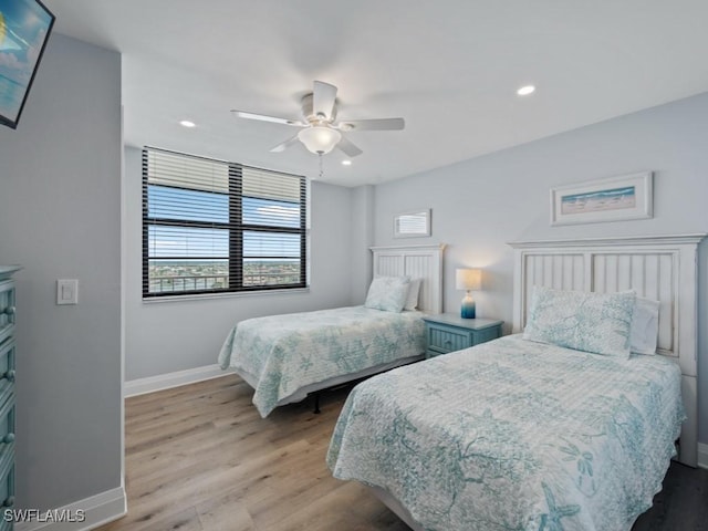 bedroom with baseboards, recessed lighting, and wood finished floors