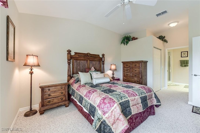 carpeted bedroom with vaulted ceiling, baseboards, ceiling fan, and a closet
