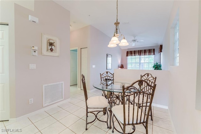 dining space featuring light tile patterned flooring, ceiling fan, and baseboards
