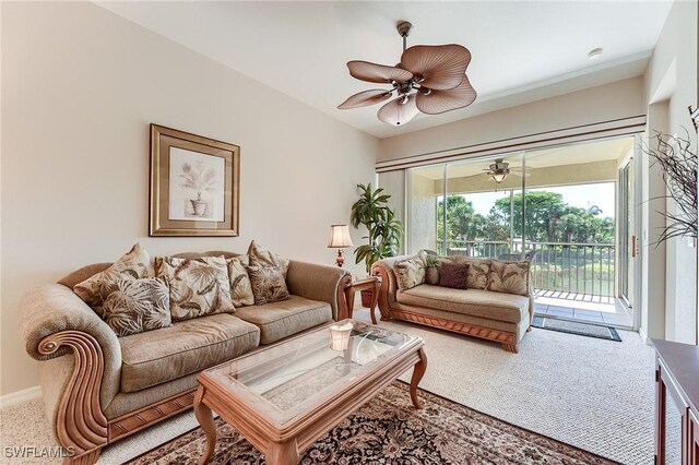 carpeted living room featuring ceiling fan