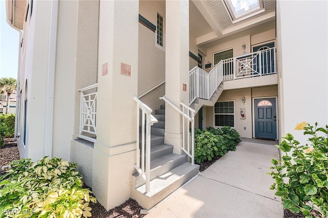 view of property featuring stairs
