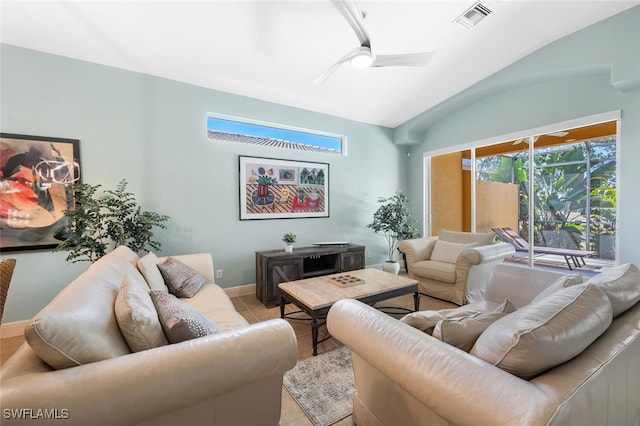 tiled living area featuring lofted ceiling, ceiling fan, and baseboards