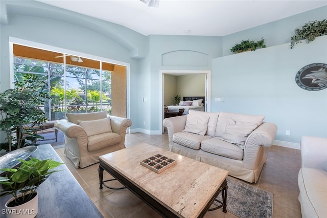 living room with light tile patterned floors and baseboards