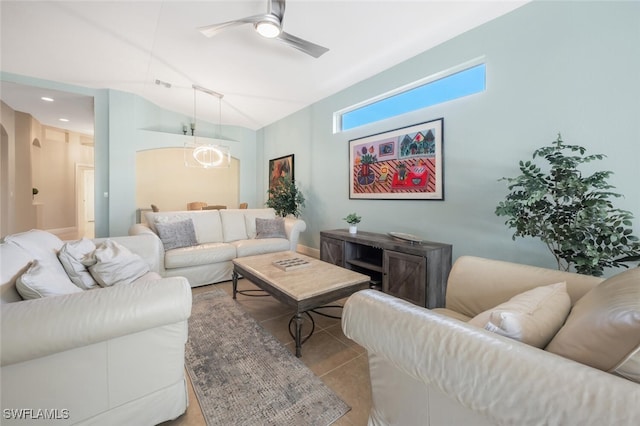 living room featuring a ceiling fan and arched walkways