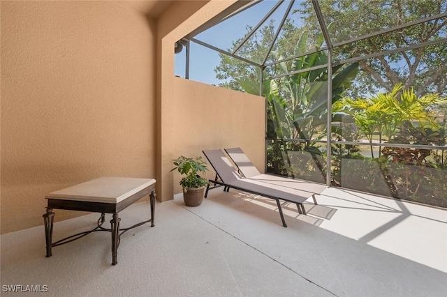 view of patio with a lanai