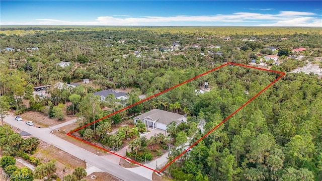 2712 14th Ave SE, Naples, FL 34117 - aerial view of property's location featuring a heavily wooded area and property parcel outlined