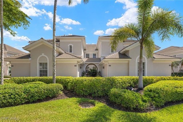 14572 Bellino Ter Unit 202, Bonita Springs, FL 34135 - mediterranean / spanish-style house with stucco siding and a tiled roof