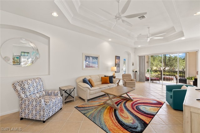14572 Bellino Ter Unit 202, Bonita Springs, FL 34135 - living area featuring a ceiling fan, a raised ceiling, and light tile patterned flooring