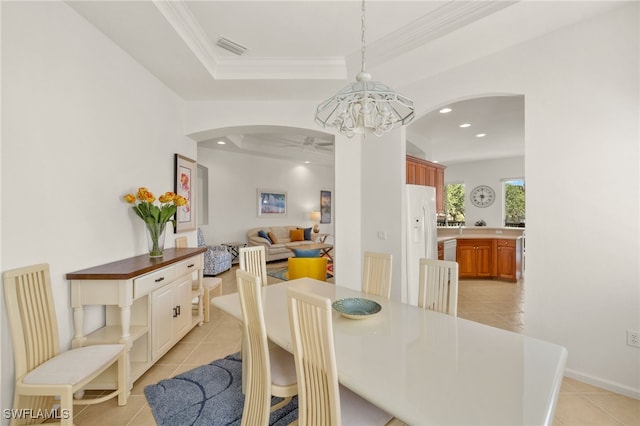 14572 Bellino Ter Unit 202, Bonita Springs, FL 34135 - dining area with ornamental molding, light tile patterned floors, a ceiling fan, and arched walkways
