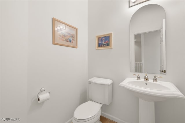14572 Bellino Ter Unit 202, Bonita Springs, FL 34135 - half bath featuring toilet and baseboards