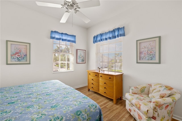 14572 Bellino Ter Unit 202, Bonita Springs, FL 34135 - bedroom featuring light wood-type flooring, baseboards, and a ceiling fan