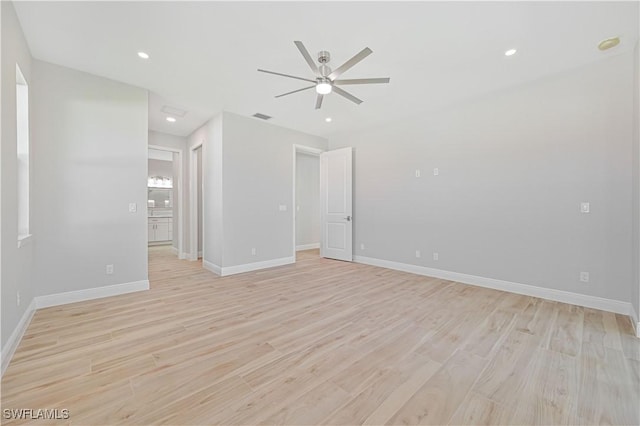 unfurnished room with visible vents, light wood-style floors, baseboards, ceiling fan, and recessed lighting