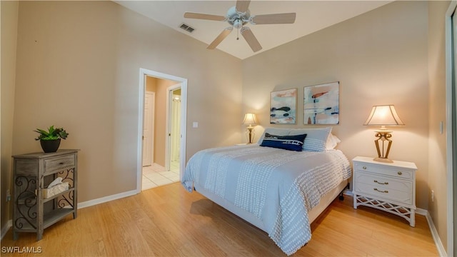 bedroom with light wood-style floors, baseboards, and visible vents