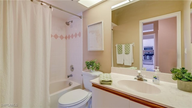 full bathroom featuring toilet, shower / bath combination with curtain, and vanity