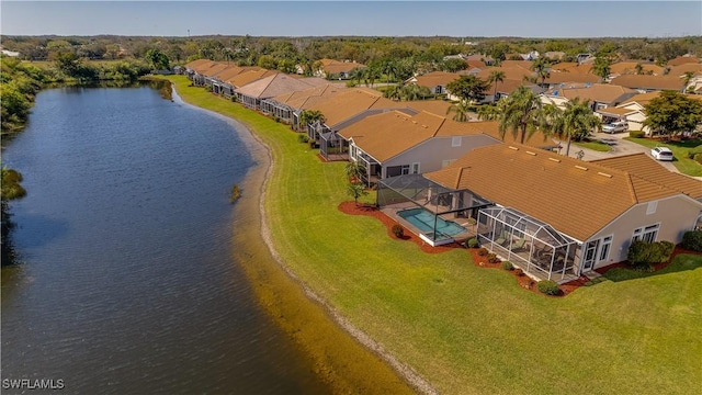 drone / aerial view featuring a residential view and a water view