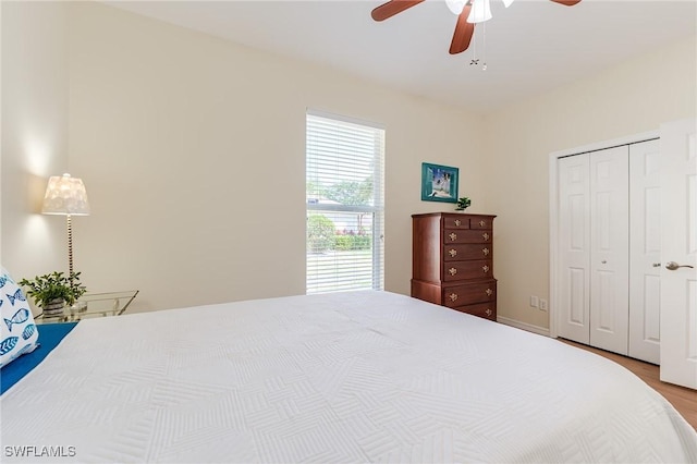 23061 Grassy Pine Dr, Estero, FL 33928 - bedroom featuring a closet, ceiling fan, and wood finished floors