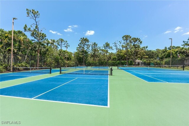 23061 Grassy Pine Dr, Estero, FL 33928 - view of tennis court featuring fence