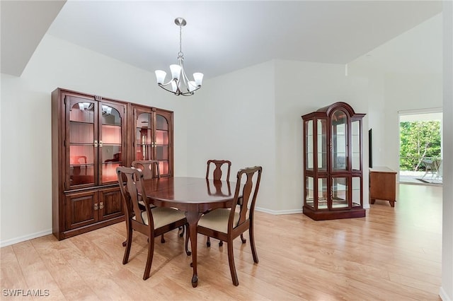 23061 Grassy Pine Dr, Estero, FL 33928 - dining room with baseboards, an inviting chandelier, and light wood finished floors