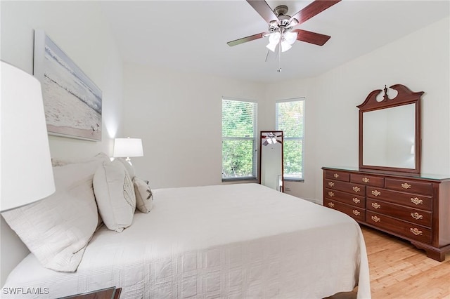 23061 Grassy Pine Dr, Estero, FL 33928 - bedroom with a ceiling fan and light wood-style floors