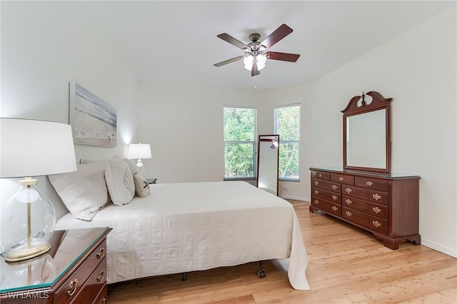 23061 Grassy Pine Dr, Estero, FL 33928 - bedroom featuring light wood-style floors, baseboards, and a ceiling fan