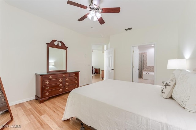 23061 Grassy Pine Dr, Estero, FL 33928 - bedroom with ceiling fan, visible vents, baseboards, connected bathroom, and light wood-style flooring