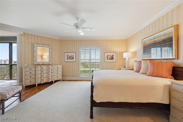 8477 Bay Colony Dr Unit 1102, Naples, FL 34108 - bedroom with crown molding, wallpapered walls, and wood finished floors