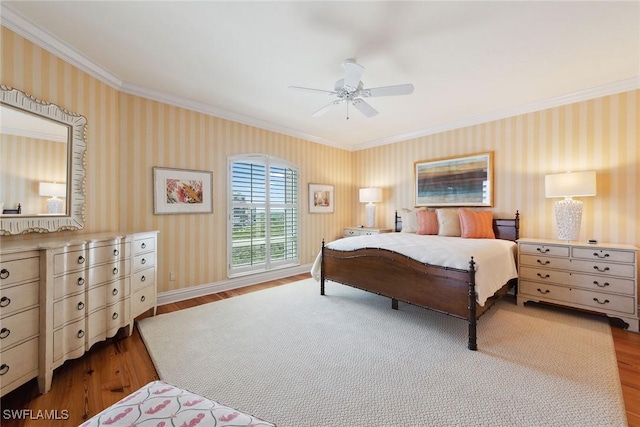 8477 Bay Colony Dr Unit 1102, Naples, FL 34108 - bedroom with ceiling fan, crown molding, wood finished floors, baseboards, and wallpapered walls