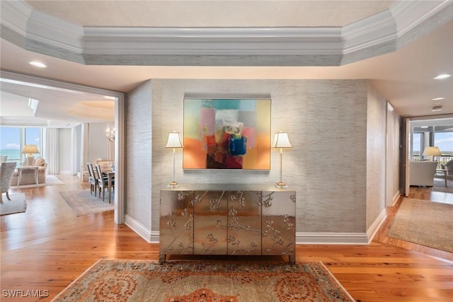 8477 Bay Colony Dr Unit 1102, Naples, FL 34108 - hallway with baseboards, ornamental molding, and wood finished floors