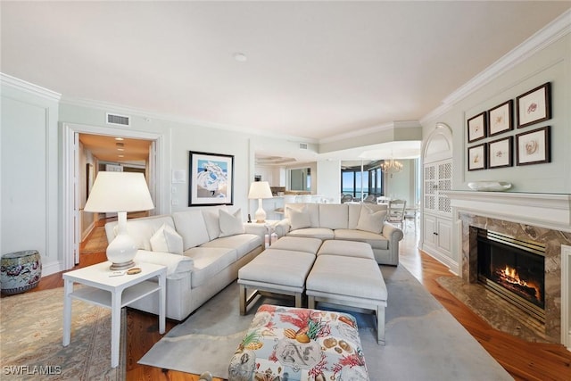 8477 Bay Colony Dr Unit 1102, Naples, FL 34108 - living area featuring crown molding, visible vents, and wood finished floors