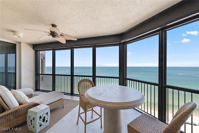 8477 Bay Colony Dr Unit 1102, Naples, FL 34108 - sunroom / solarium featuring a water view and a textured ceiling