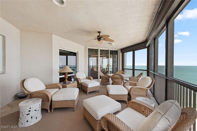 8477 Bay Colony Dr Unit 1102, Naples, FL 34108 - sunroom / solarium featuring a water view, carpet flooring, and a textured ceiling