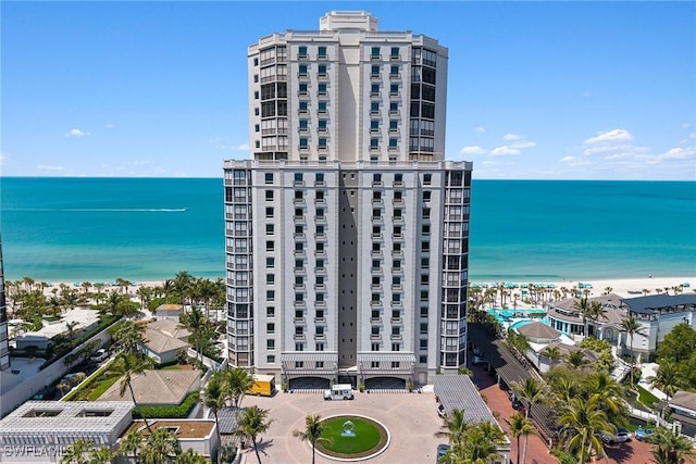 8477 Bay Colony Dr Unit 1102, Naples, FL 34108 - view of building exterior with a water view