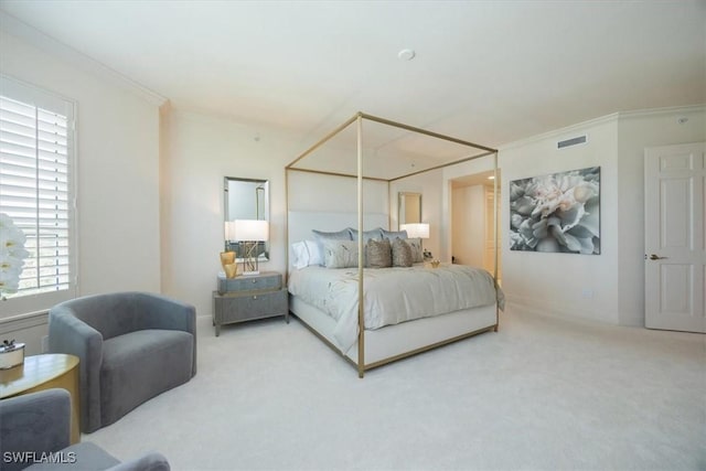 bedroom with carpet, ornamental molding, and baseboards