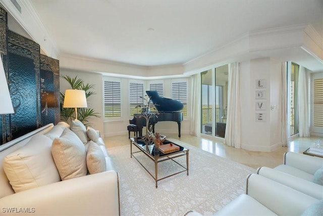 living area featuring crown molding, healthy amount of natural light, and baseboards