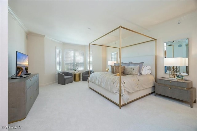 bedroom with ornamental molding, carpet, and baseboards