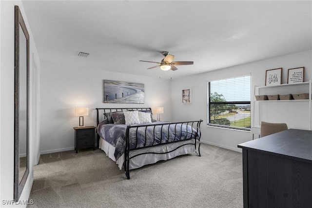 bedroom with light colored carpet, baseboards, a ceiling fan, and visible vents