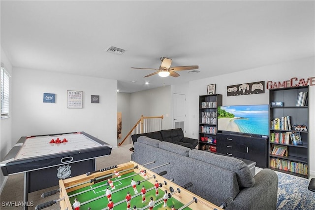 recreation room with carpet flooring, visible vents, baseboards, and a ceiling fan