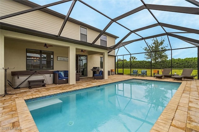pool featuring ceiling fan, a hot tub, area for grilling, and a patio area