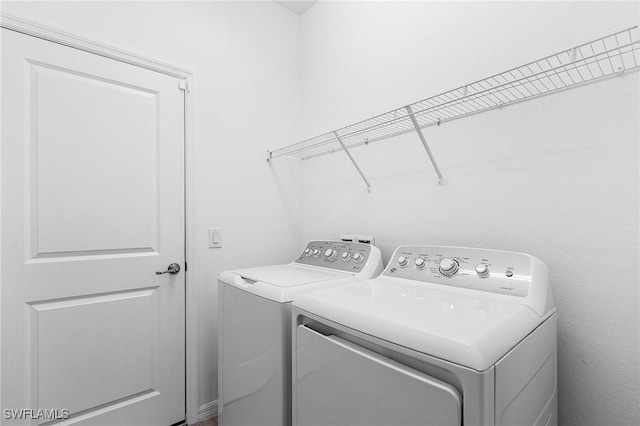 laundry area featuring laundry area and independent washer and dryer