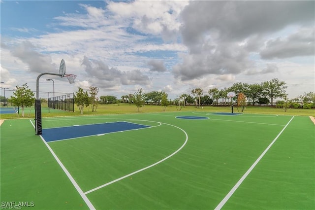 view of sport court featuring community basketball court and fence