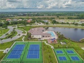 birds eye view of property with a water view