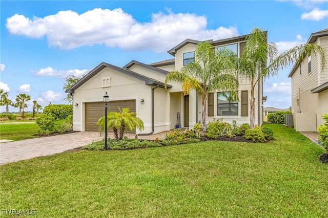 view of front of property featuring driveway, an attached garage, central air condition unit, stucco siding, and a front yard