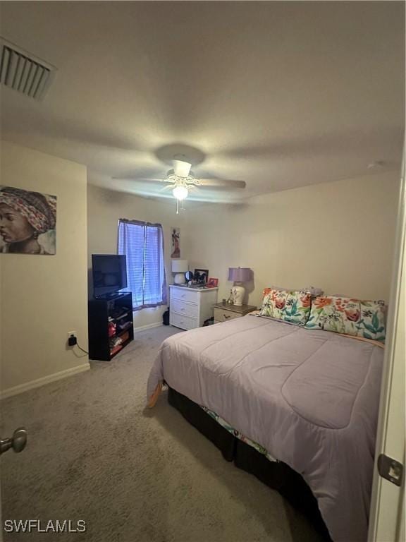 carpeted bedroom featuring a ceiling fan, baseboards, and visible vents