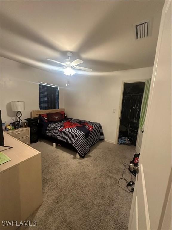 carpeted bedroom with visible vents and ceiling fan