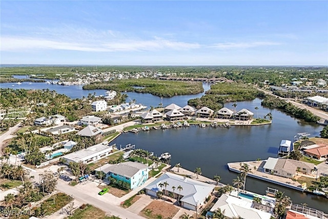 birds eye view of property with a residential view and a water view