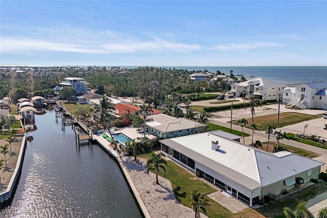 bird's eye view with a residential view and a water view