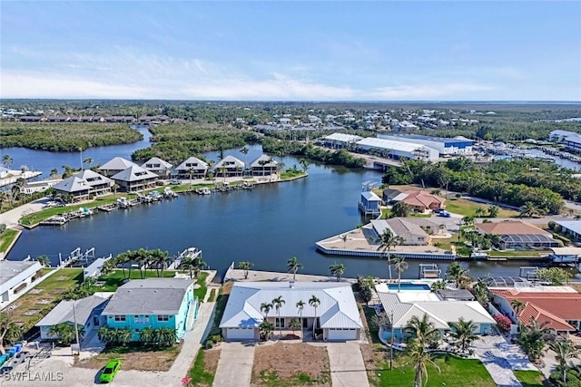 drone / aerial view featuring a water view and a residential view