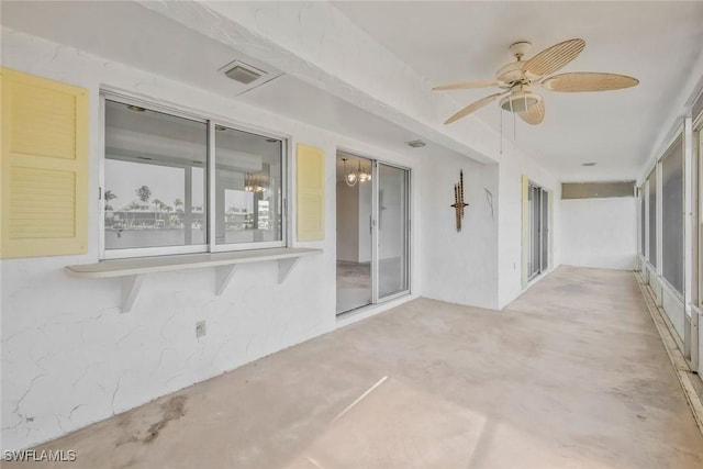 unfurnished sunroom featuring visible vents and an inviting chandelier